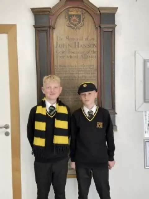 Students of today wearing the original cap, Scarf and tie.
